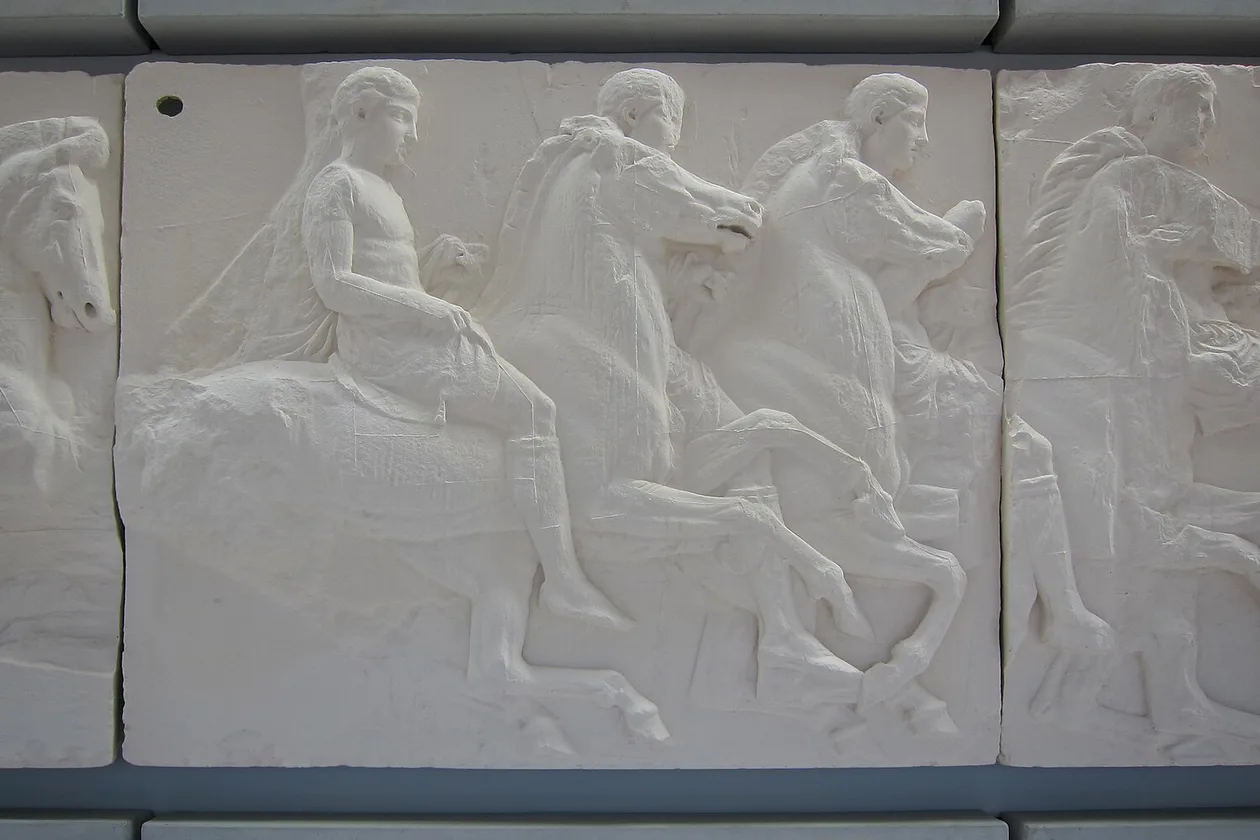 Parthenon frieze showing the Panathenaic Procession with horses, chariots, and figures