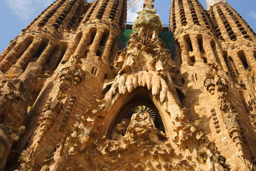 Sagrada Família — blue and green stained glass on the Nativity side
