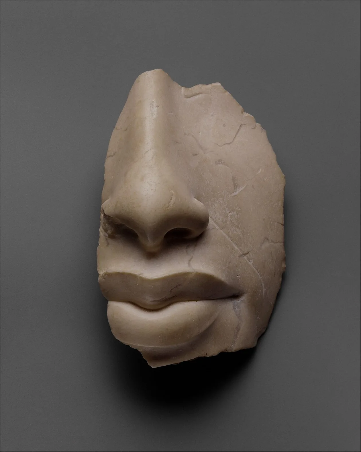 Stone fragment of a face of Akhenaten preserving only the nose and lips, Amarna period