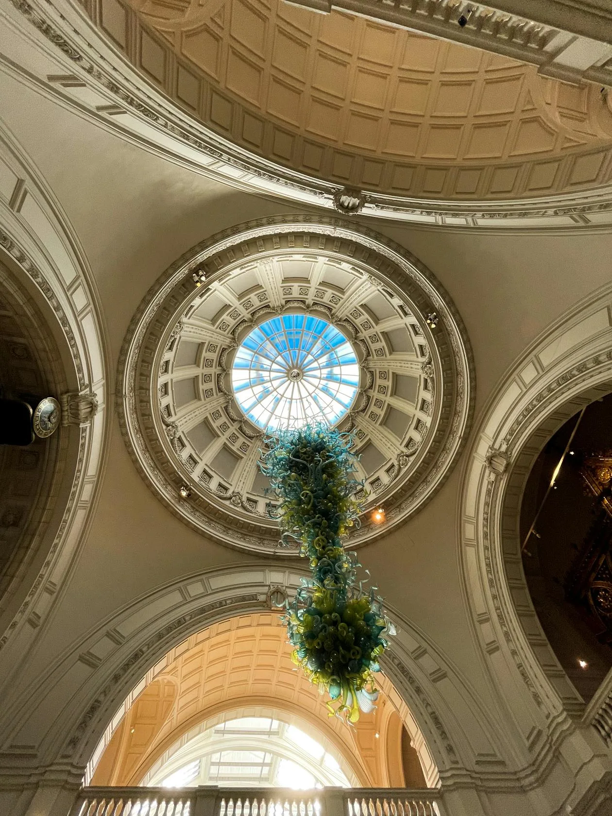 Interior of the Victoria and Albert Museum, London, with ornate Victorian columns and arched ceiling