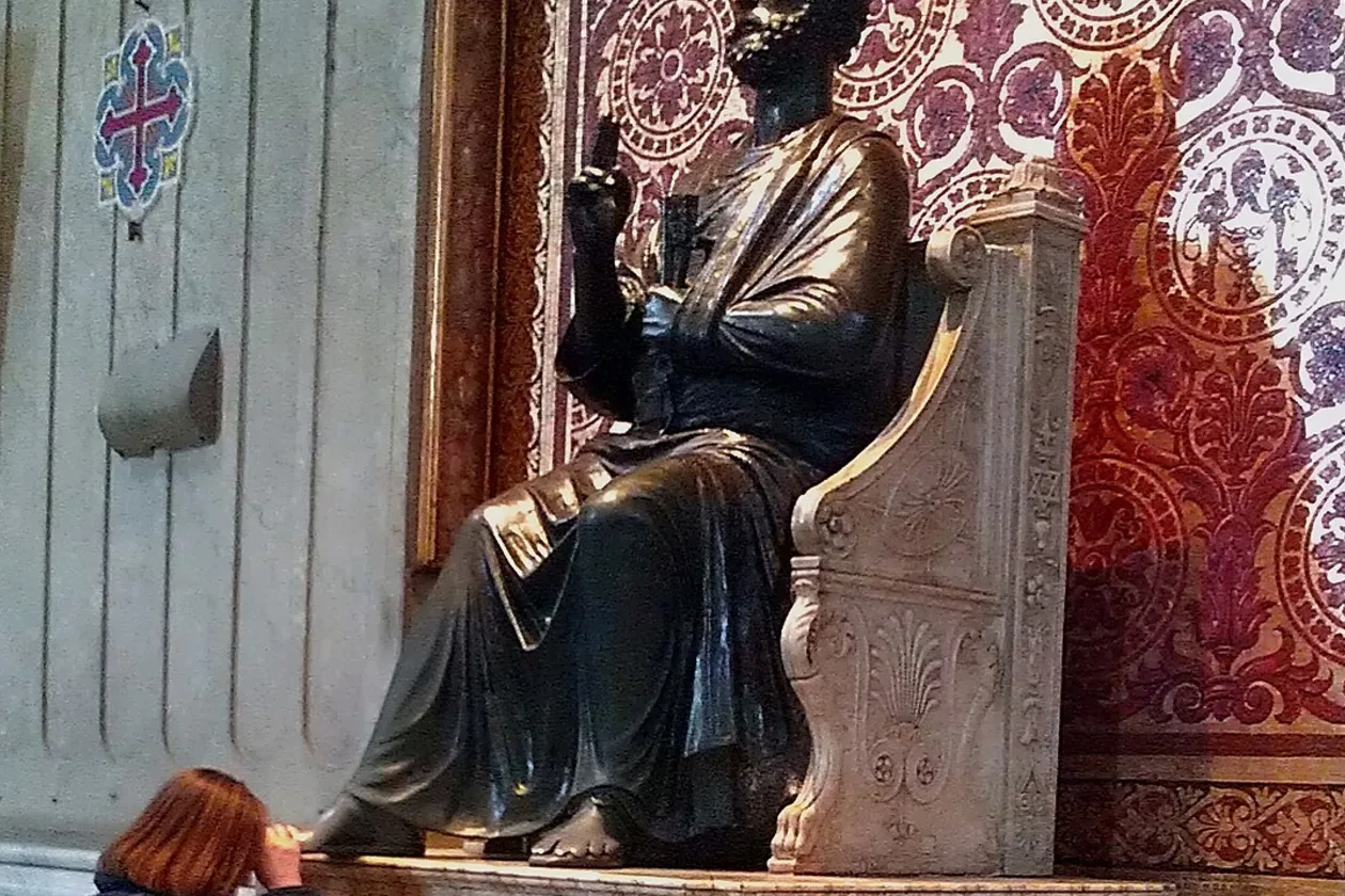 The worn bronze right foot of the statue of St Peter in St Peter's Basilica