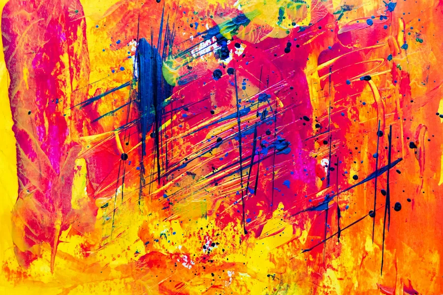 Colourful abstract paint strokes in bright yellows, reds and blues — evoking the energy of Pop Art