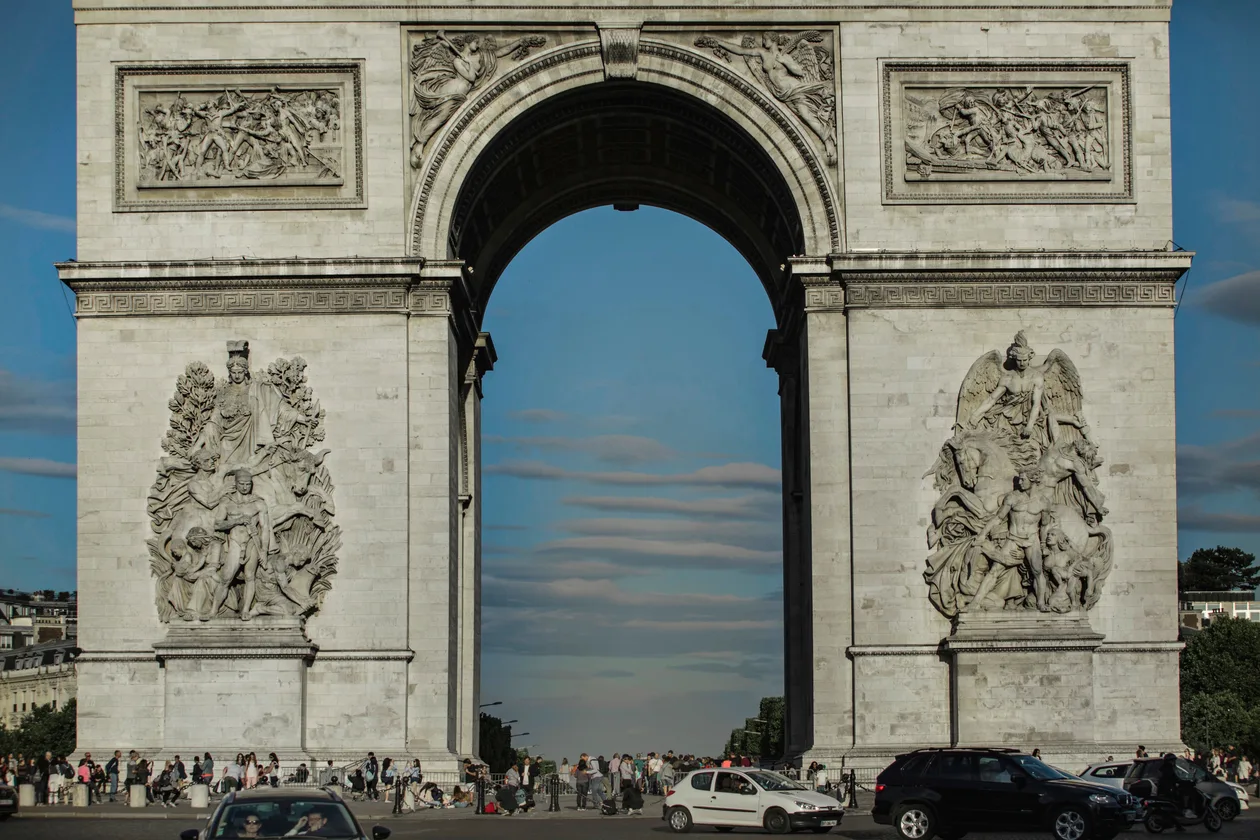 The Arc de Triomphe seen from the Champs-Elysees at dusk