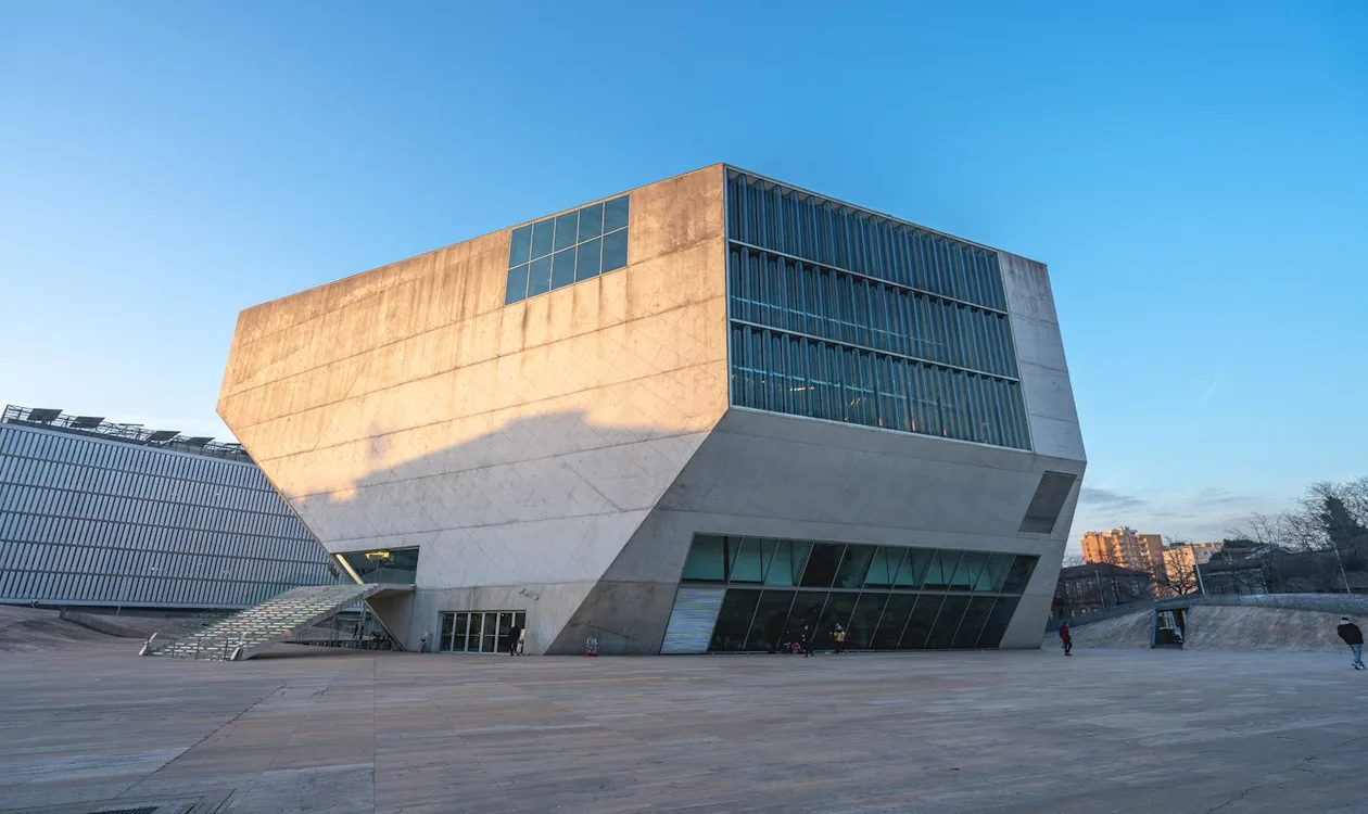 Casa da Música in Porto — Rem Koolhaas's faceted white concrete concert hall against a blue sky