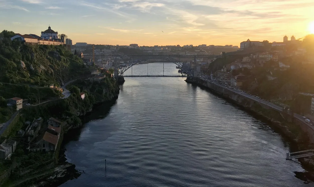 Douro river at sunset with Dom Luís I Bridge between Porto and Vila Nova de Gaia