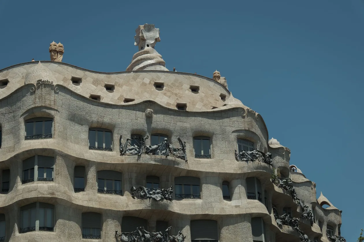 The undulating stone facade and iron balconies of Casa Mila on Passeig de Gracia